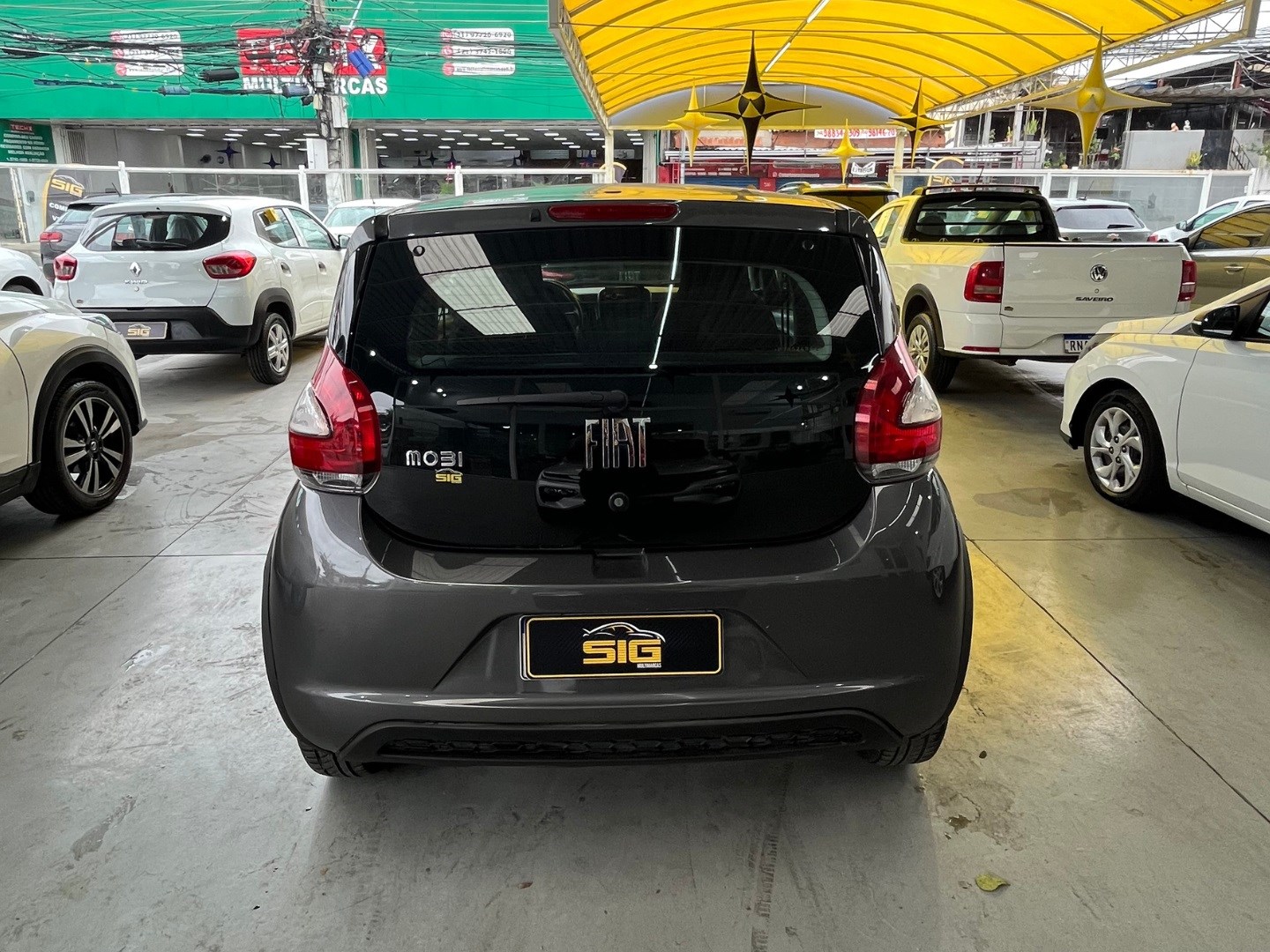 FIAT MOBI 1.0 EVO FLEX LIKE. MANUAL 2023 Cinza seminovo à venda em Duque de Caxias - Miniatura Traseira - SIG Multimarcas