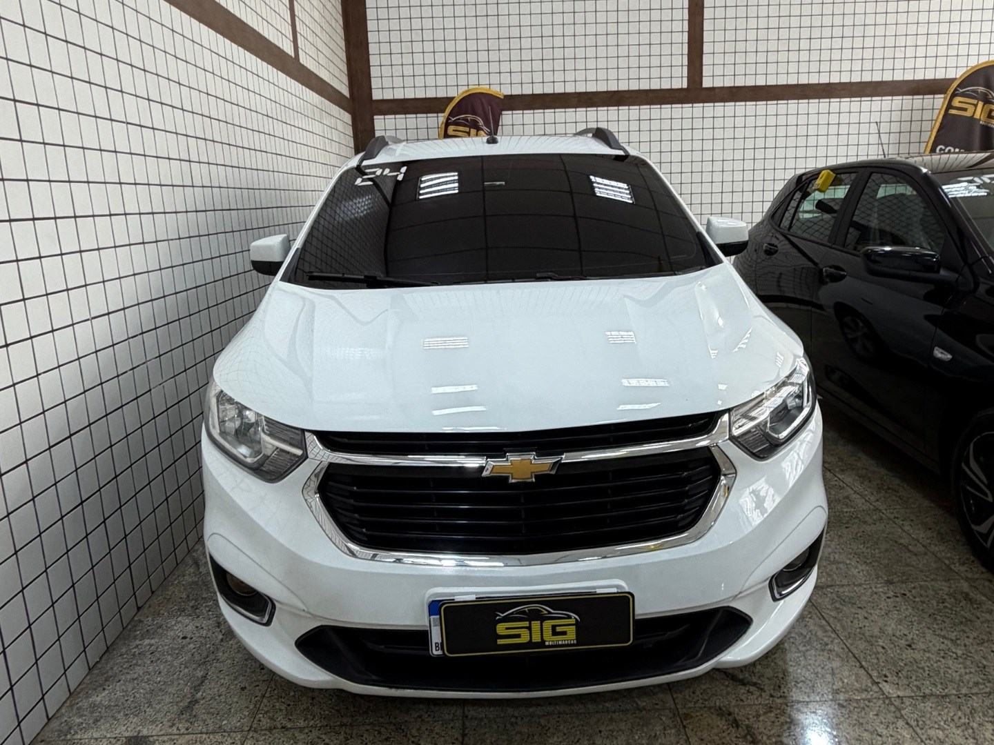 CHEVROLET SPIN SPIN PREMIER 7L 1.8 8V ECONOFLEX 4P C/AR - AUTOMÁTICO 2024 Branco seminovo à venda em Duque de Caxias - Frente - SIG Multimarcas