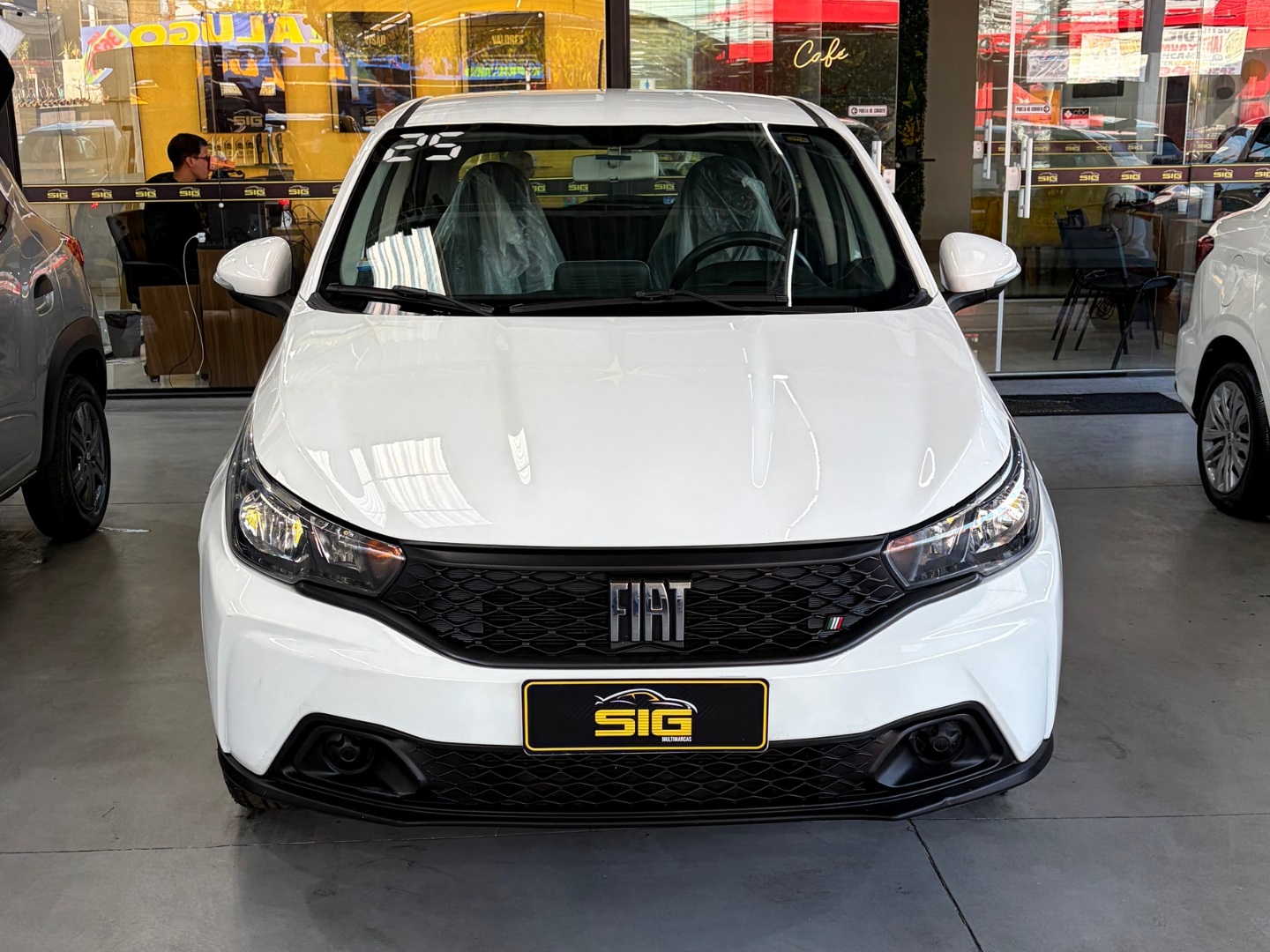 FIAT ARGO 1.0 FIREFLY FLEX DRIVE MANUAL 2025 Branco seminovo à venda em Duque de Caxias - Miniatura Lateral - SIG Multimarcas