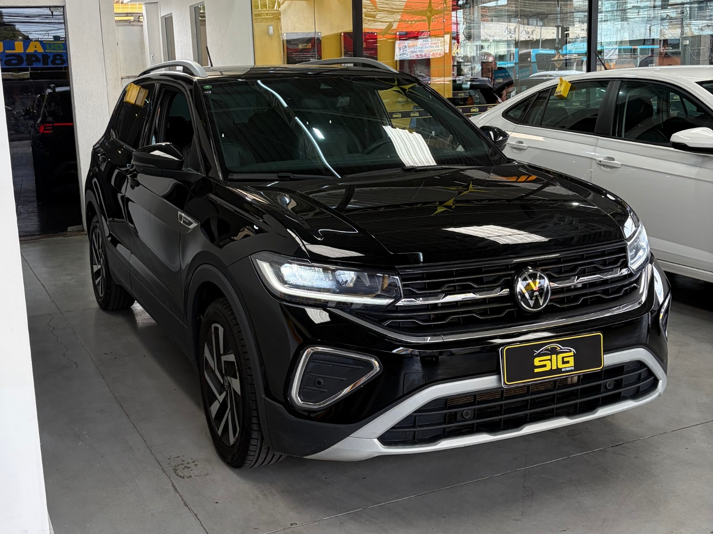 VOLKSWAGEN T-CROSS 1.4 250 TSI TOTAL FLEX HIGHLINE AUTOMÁTICO 2025 Preto seminovo à venda em Duque de Caxias - Miniatura Traseira - SIG Multimarcas