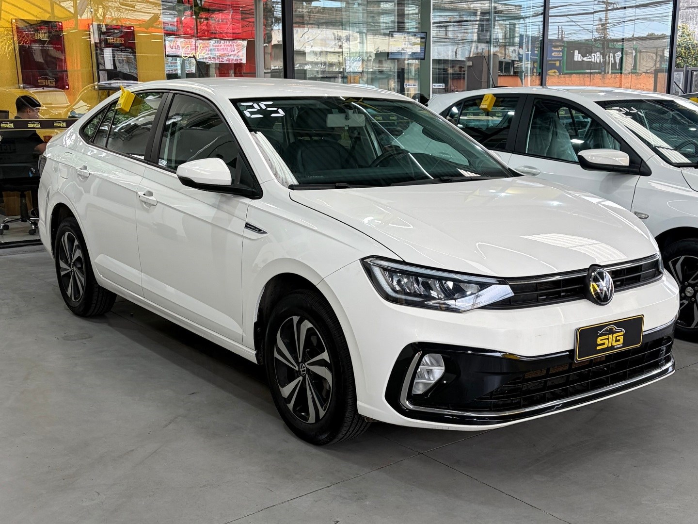 VOLKSWAGEN VIRTUS 1.0 200 TSI COMFORTLINE AUTOMÁTICO 2025 Branco seminovo à venda em Duque de Caxias - Miniatura Lateral - SIG Multimarcas