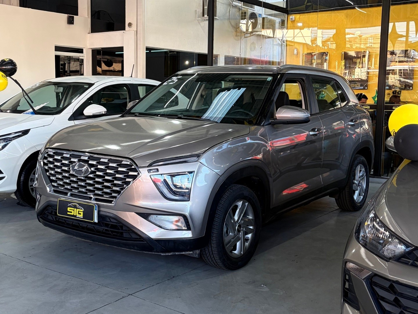 HYUNDAI CRETA 1.0 TGDI FLEX COMFORT PLUS AUTOMÁTICO 2025 Prata seminovo à venda em Duque de Caxias - Miniatura Traseira - SIG Multimarcas