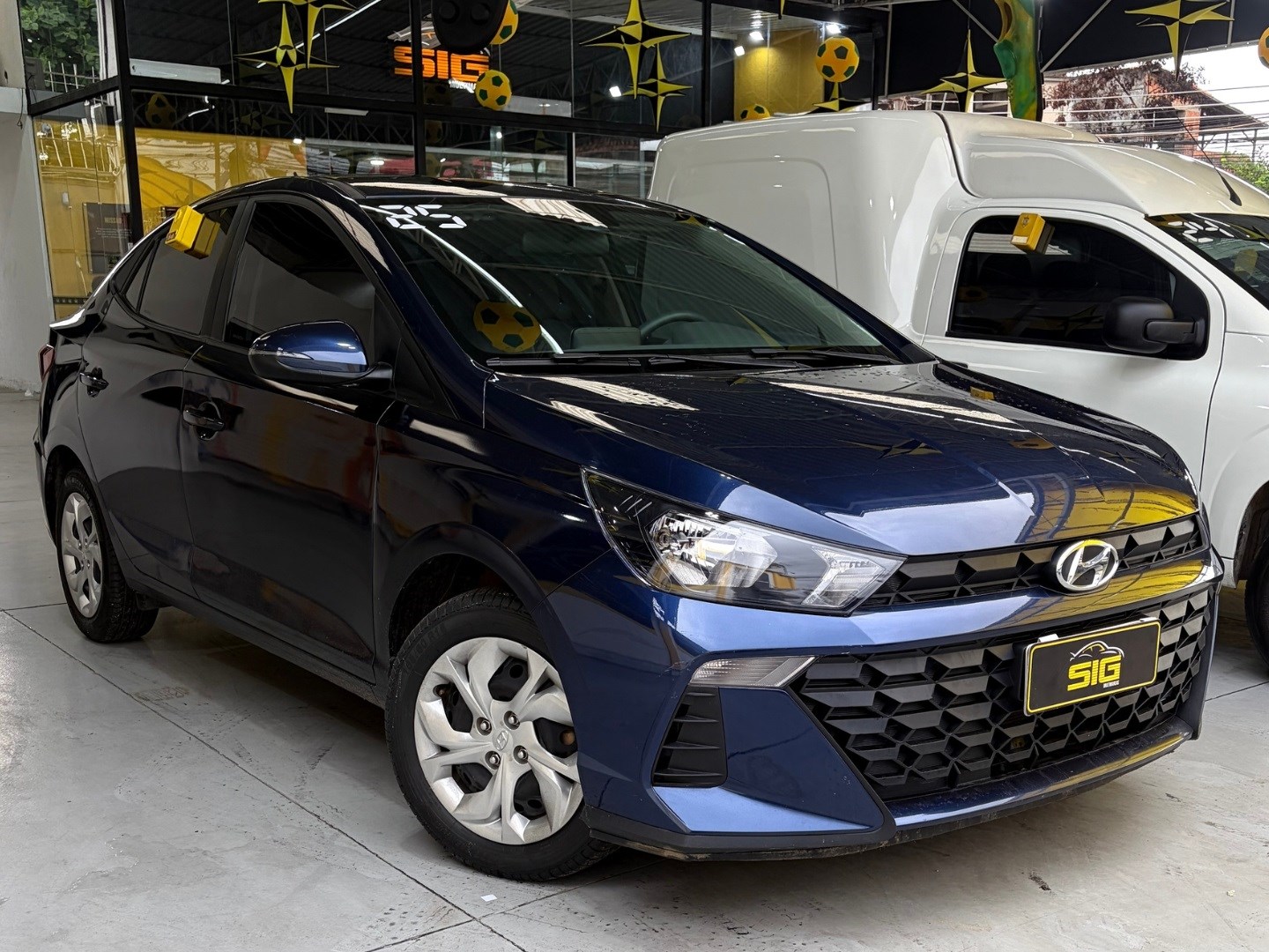 HYUNDAI HB20S 1.0 12V FLEX COMFORT PLUS MANUAL 2025 Azul seminovo à venda em Duque de Caxias - Frente - SIG Multimarcas