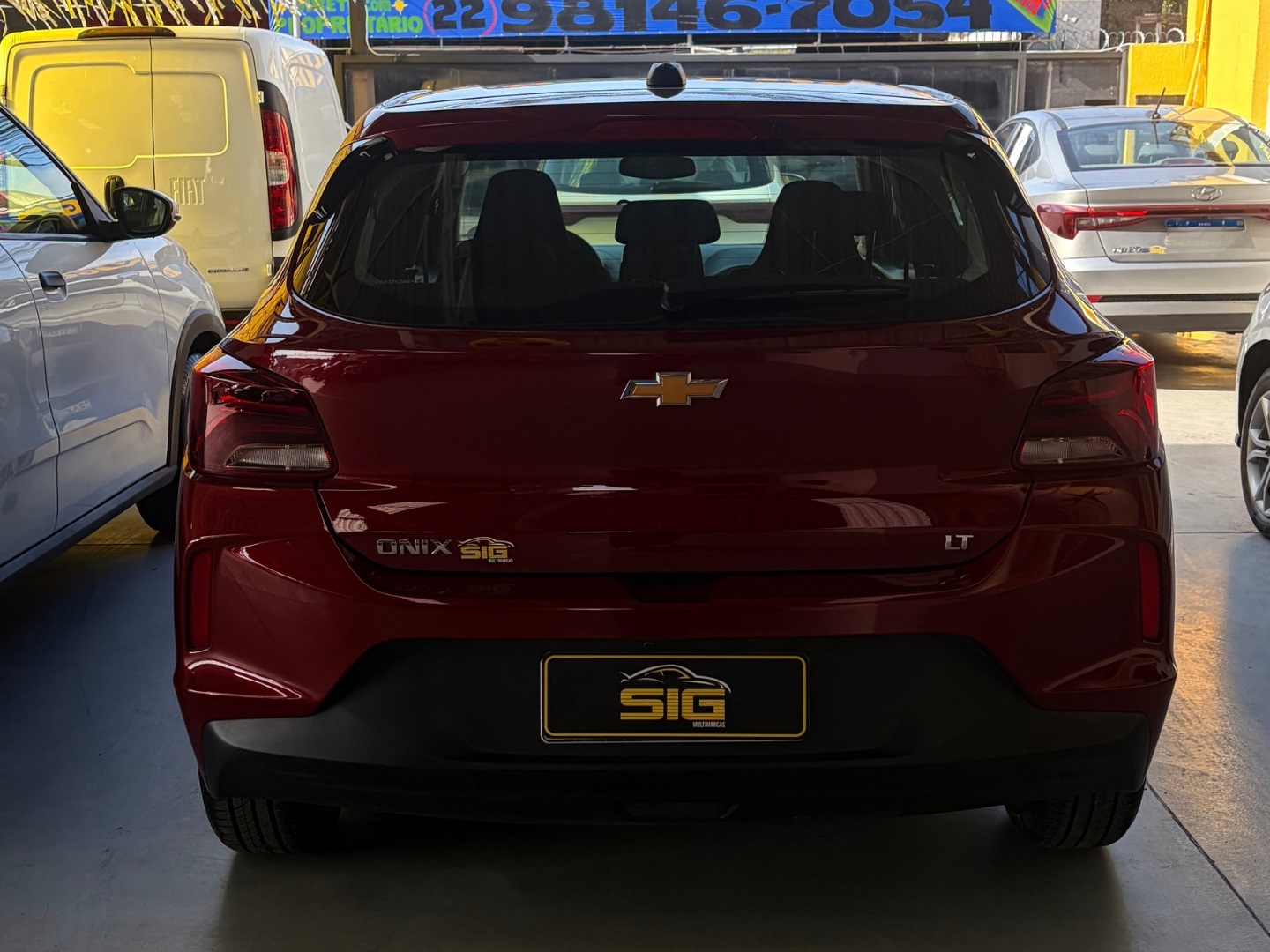 CHEVROLET ONIX 1.0 FLEX LT MANUAL 2025 Vermelho seminovo à venda em Duque de Caxias - Miniatura Interior - SIG Multimarcas
